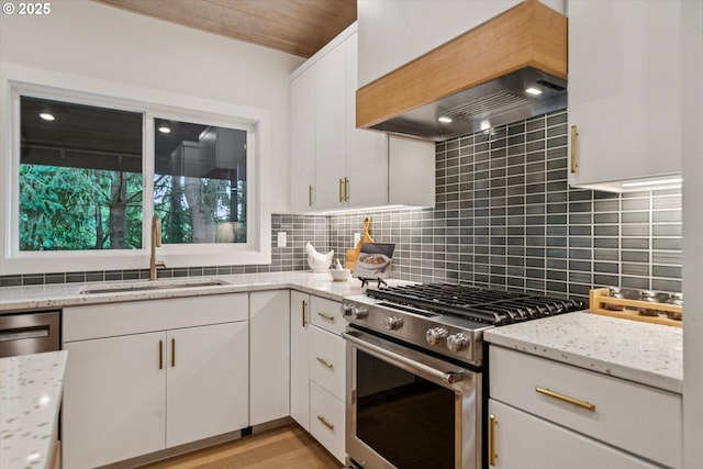17253 SW Rivendell Dr, Portland, OR 97224 - kitchen featuring stainless steel range, premium range hood, and white cabinets