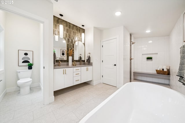 17253 SW Rivendell Dr, Portland, OR 97224 - bathroom with a soaking tub, double vanity, tile patterned flooring, and recessed lighting
