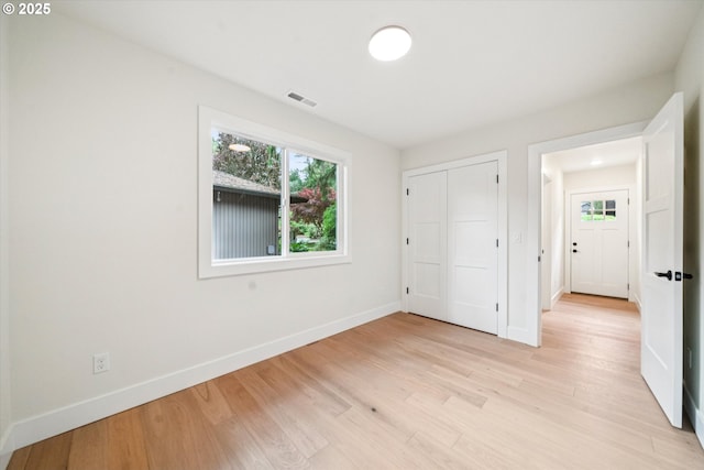 17253 SW Rivendell Dr, Portland, OR 97224 - unfurnished bedroom with light wood-style floors and a closet