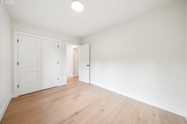 17253 SW Rivendell Dr, Portland, OR 97224 - unfurnished bedroom with light wood-style flooring and a closet