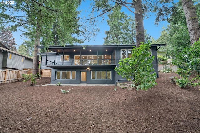 17253 SW Rivendell Dr, Portland, OR 97224 - rear view of property with a balcony and a fenced backyard