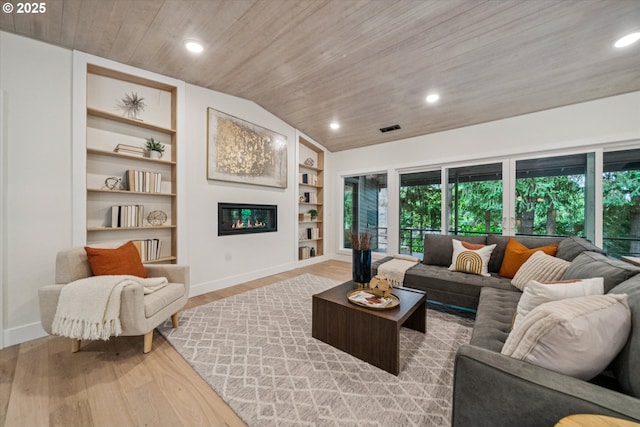 17253 SW Rivendell Dr, Portland, OR 97224 - living area featuring wooden ceiling, built in features, light wood finished floors, vaulted ceiling, and recessed lighting