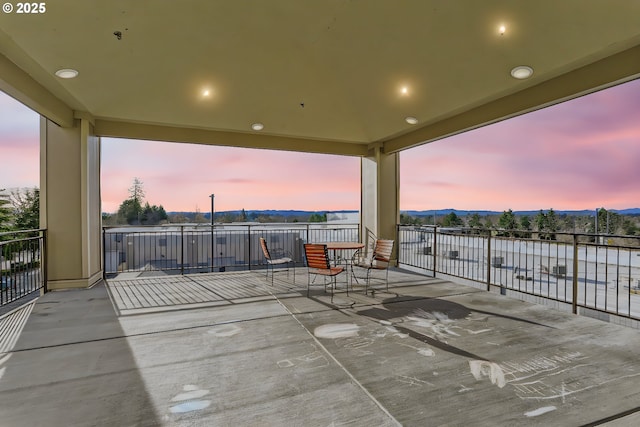 patio terrace at dusk with a mountain view