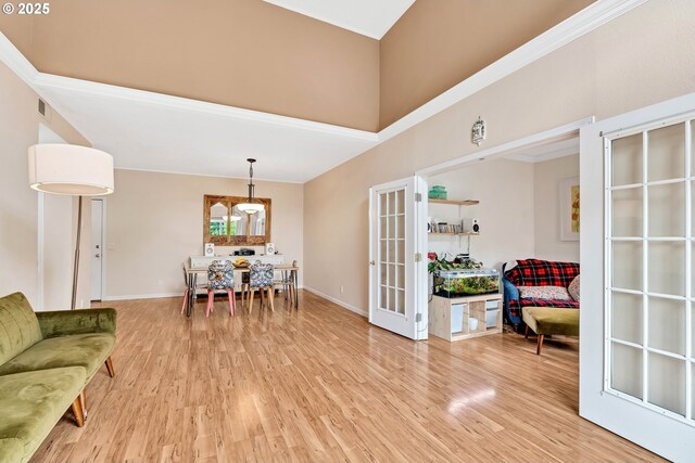 4320 S Corbett Ave Unit 302, Portland, OR 97239 - living room with french doors, light wood-type flooring, baseboards, and a high ceiling