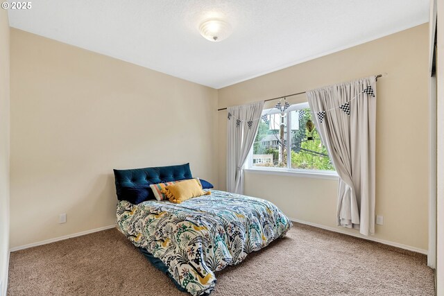 4320 S Corbett Ave Unit 302, Portland, OR 97239 - bedroom featuring carpet floors and baseboards
