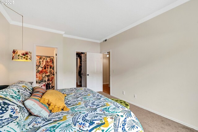 4320 S Corbett Ave Unit 302, Portland, OR 97239 - bedroom with carpet flooring, crown molding, baseboards, a spacious closet, and a closet