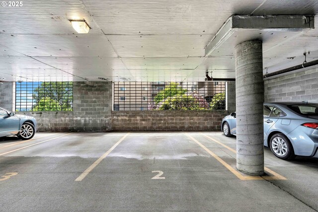 4320 S Corbett Ave Unit 302, Portland, OR 97239 - parking garage featuring concrete block wall