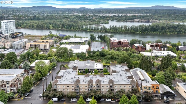 4320 S Corbett Ave Unit 302, Portland, OR 97239 - aerial view of a water and mountain view and a heavily wooded area
