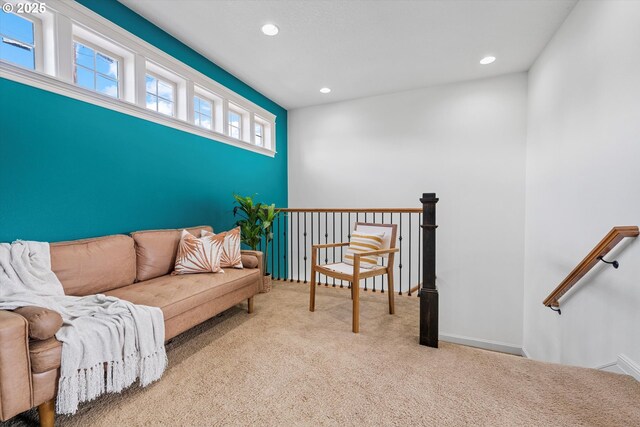 carpeted living area featuring recessed lighting