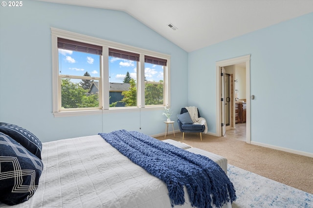 bedroom with vaulted ceiling, carpet, and baseboards