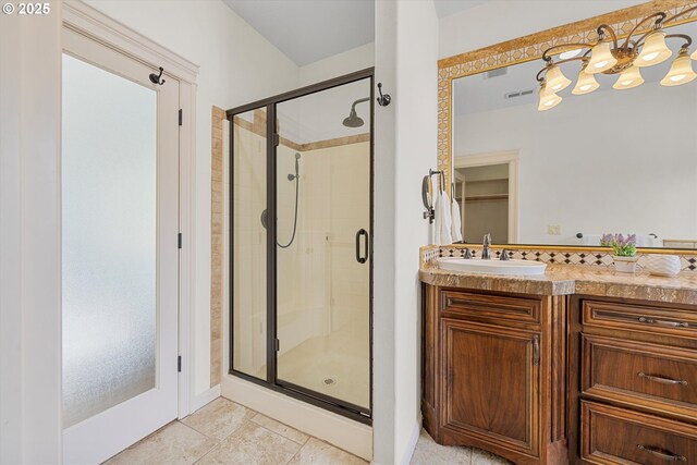 bathroom featuring a shower stall, vanity, and baseboards