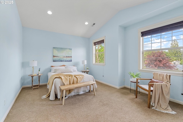 bedroom with light carpet, lofted ceiling, baseboards, and recessed lighting