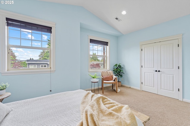 carpeted bedroom featuring lofted ceiling, a closet, baseboards, and recessed lighting