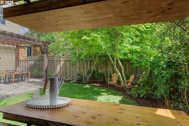 wooden terrace featuring a pergola, a fenced backyard, outdoor dining area, and a patio area