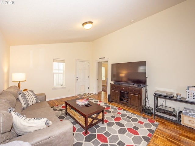 13311 NE 50th Way, Vancouver, WA 98682 - living room featuring lofted ceiling, wood finished floors, and baseboards