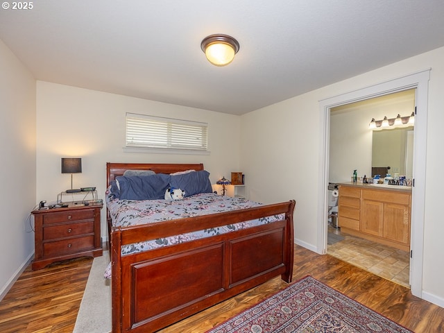 13311 NE 50th Way, Vancouver, WA 98682 - bedroom featuring dark wood-style flooring, baseboards, and ensuite bath