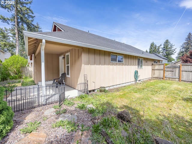 13311 NE 50th Way, Vancouver, WA 98682 - view of side of property with a patio area and roof with shingles
