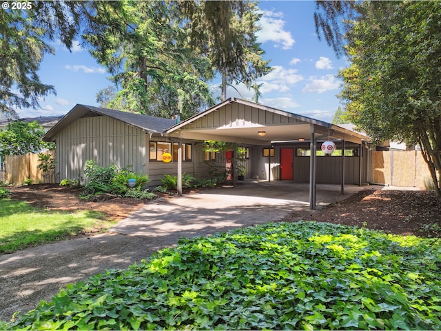 311 NE 130th Pl, Portland, OR 97230 - view of front of house featuring board and batten siding, asphalt driveway, and a carport