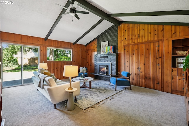 311 NE 130th Pl, Portland, OR 97230 - carpeted living area featuring wooden walls, a ceiling fan, a brick fireplace, and a textured ceiling
