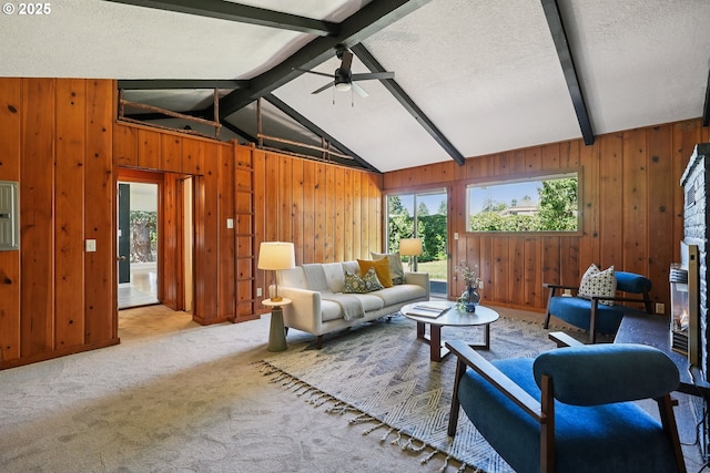 311 NE 130th Pl, Portland, OR 97230 - carpeted living room featuring healthy amount of natural light, wood walls, ceiling fan, and a textured ceiling
