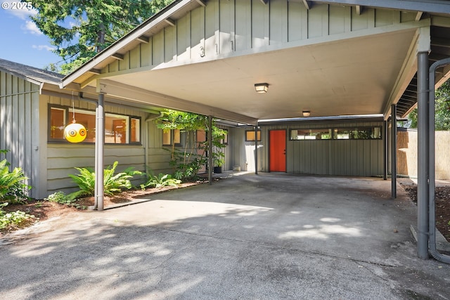 311 NE 130th Pl, Portland, OR 97230 - view of front of property featuring board and batten siding, a carport, and driveway