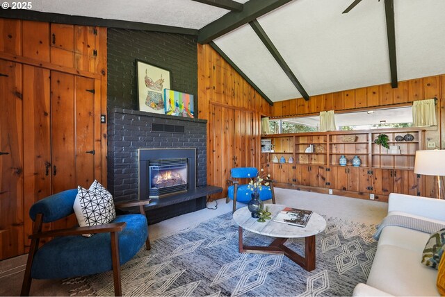 311 NE 130th Pl, Portland, OR 97230 - living room featuring wood walls, a fireplace, and carpet