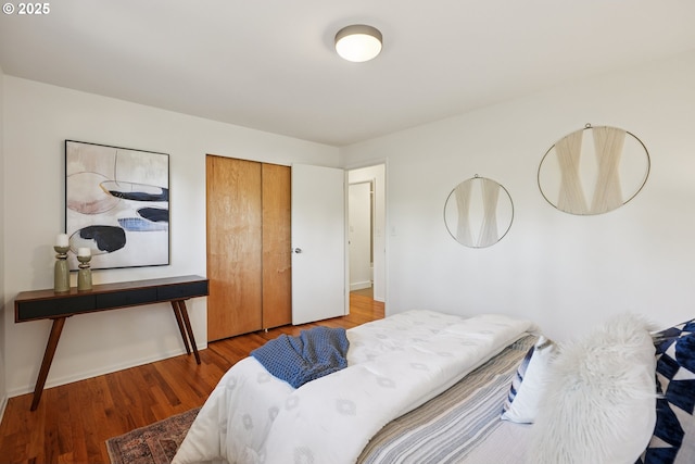 311 NE 130th Pl, Portland, OR 97230 - bedroom with wood finished floors, a closet, and baseboards