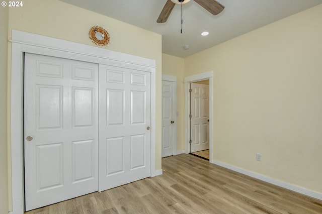 unfurnished bedroom featuring a closet, ceiling fan, and light hardwood / wood-style flooring