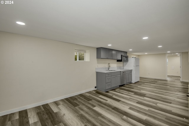 interior space with light hardwood / wood-style floors and sink