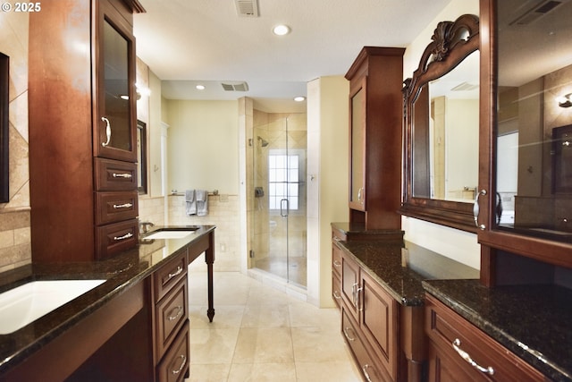 2917 NE 9th Ave, Portland, OR 97212 - bathroom with a stall shower, recessed lighting, tile patterned flooring, backsplash, and vanity