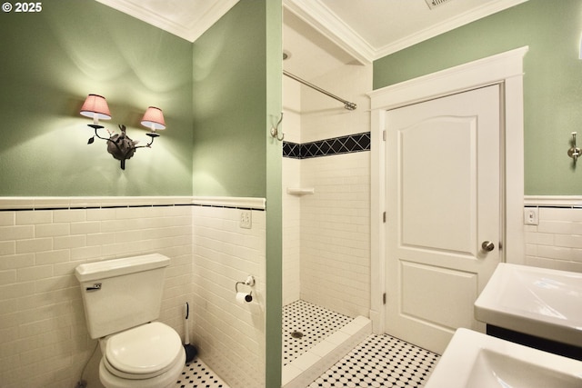2917 NE 9th Ave, Portland, OR 97212 - full bath with tile walls, ornamental molding, a stall shower, wainscoting, and toilet