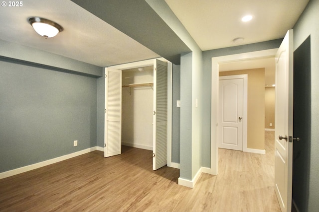 2917 NE 9th Ave, Portland, OR 97212 - unfurnished bedroom featuring light wood-style flooring, baseboards, and a closet