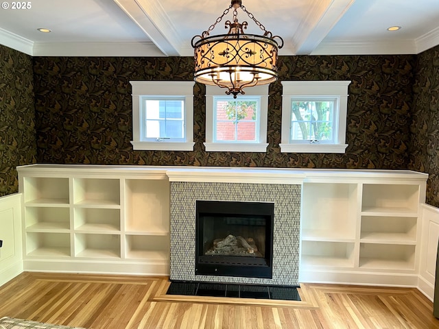 2917 NE 9th Ave, Portland, OR 97212 - detailed view of wood finished floors, beam ceiling, a chandelier, wallpapered walls, and ornamental molding
