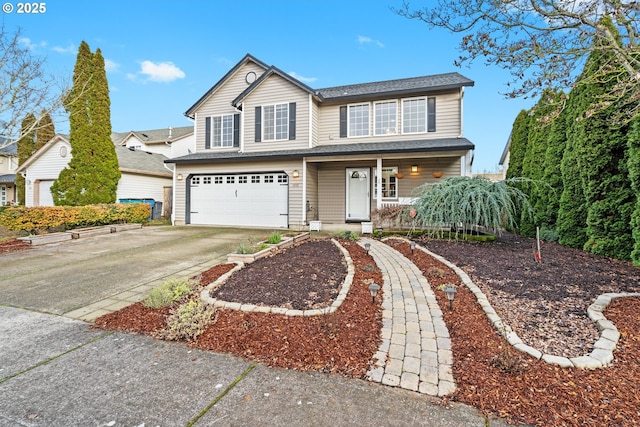 view of property featuring covered porch and a garage