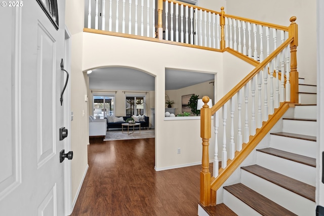 foyer entrance with dark hardwood / wood-style flooring