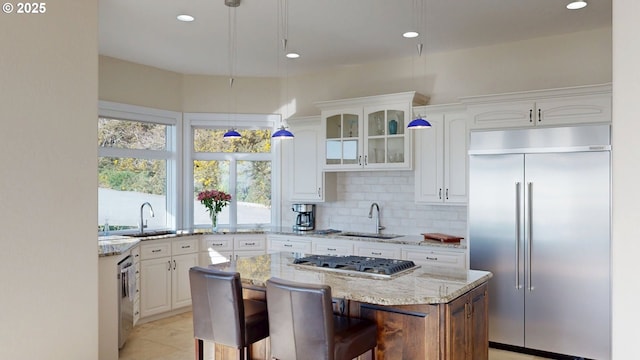 96424 Shorewood Ter, Brookings, OR 97415 - kitchen with white cabinetry, stainless steel appliances, and a sink
