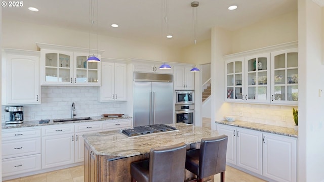 96424 Shorewood Ter, Brookings, OR 97415 - kitchen with a sink, white cabinetry, decorative backsplash, built in appliances, and glass insert cabinets