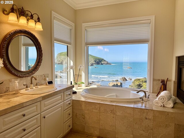 96424 Shorewood Ter, Brookings, OR 97415 - bathroom featuring ornamental molding, a bath, a water view, and vanity