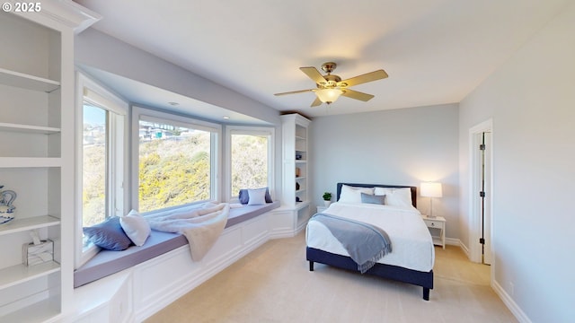 96424 Shorewood Ter, Brookings, OR 97415 - bedroom featuring ceiling fan, baseboards, and light colored carpet
