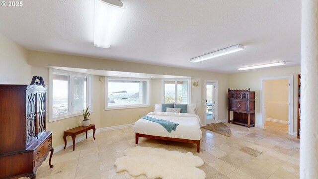 96424 Shorewood Ter, Brookings, OR 97415 - bedroom featuring light tile patterned floors and baseboards