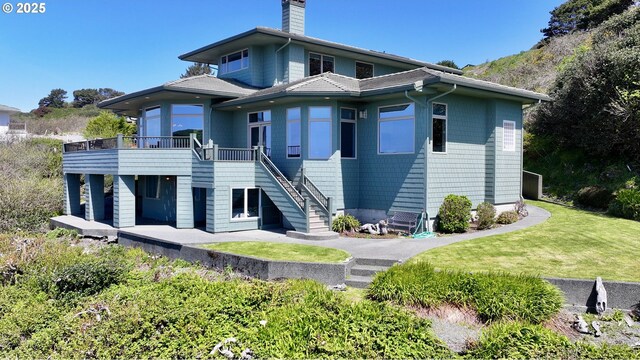 96424 Shorewood Ter, Brookings, OR 97415 - back of house featuring a lawn, stairway, a chimney, and a deck
