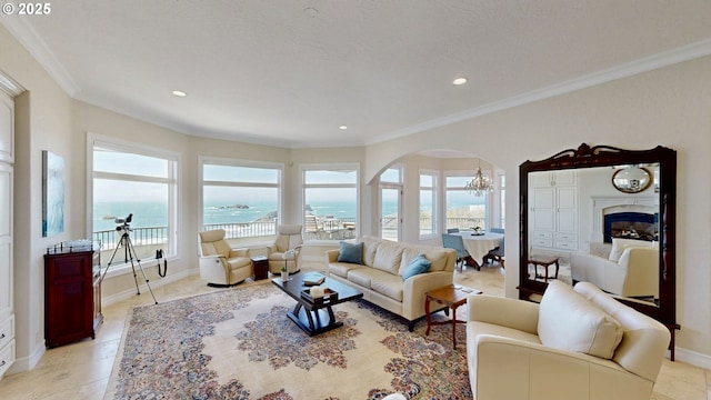 96424 Shorewood Ter, Brookings, OR 97415 - living area with crown molding, a water view, arched walkways, an inviting chandelier, and recessed lighting