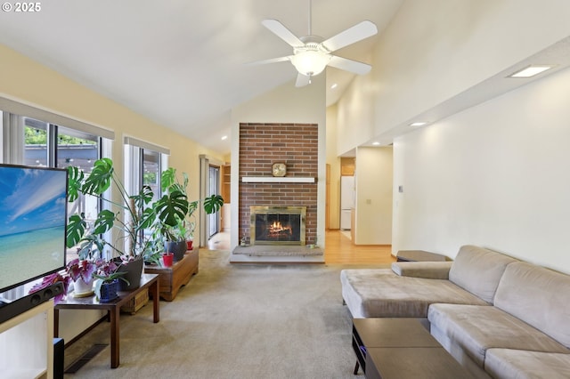 12604 NE Prescott Dr, Portland, OR 97230 - living area featuring high vaulted ceiling, a fireplace, a ceiling fan, carpet, and recessed lighting