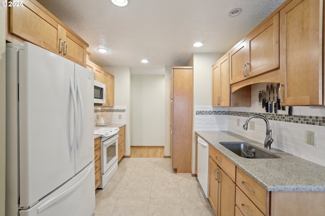 12604 NE Prescott Dr, Portland, OR 97230 - kitchen with white appliances, a sink, backsplash, light tile patterned floors, and recessed lighting