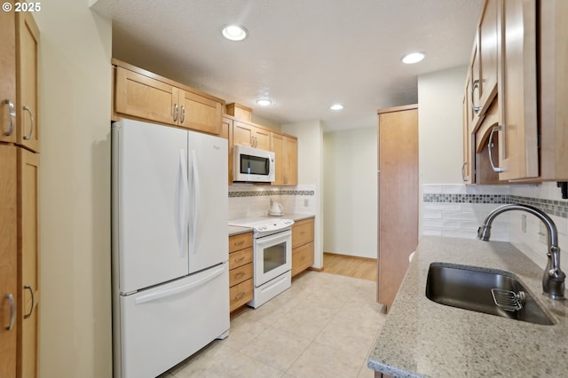 12604 NE Prescott Dr, Portland, OR 97230 - kitchen with white appliances, a sink, backsplash, light tile patterned flooring, and light brown cabinetry