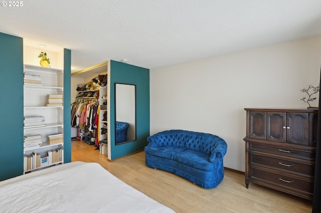 12604 NE Prescott Dr, Portland, OR 97230 - bedroom with a closet, light wood finished floors, and a walk in closet