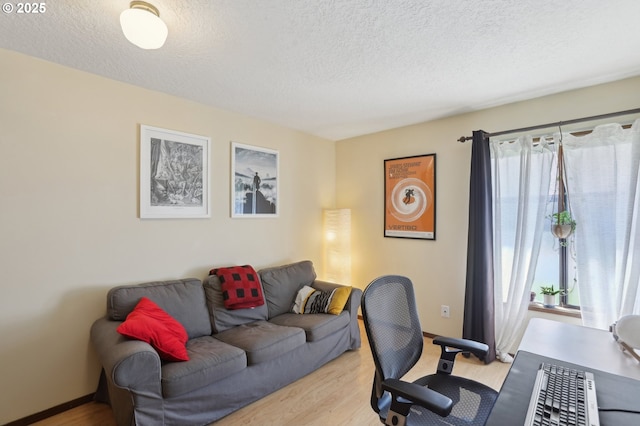 12604 NE Prescott Dr, Portland, OR 97230 - office featuring plenty of natural light, a textured ceiling, wood finished floors, and baseboards
