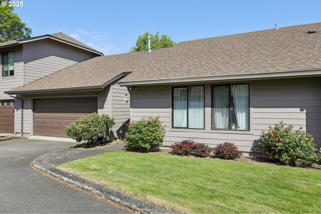 12604 NE Prescott Dr, Portland, OR 97230 - single story home with asphalt driveway, a garage, a front lawn, and a shingled roof