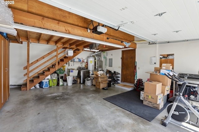 12604 NE Prescott Dr, Portland, OR 97230 - garage with a garage door opener and water heater