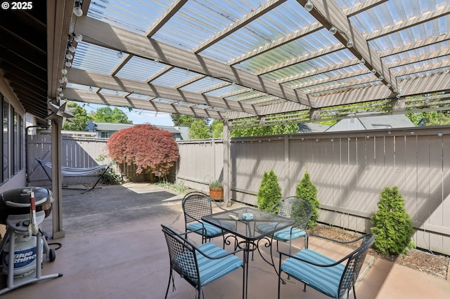 12604 NE Prescott Dr, Portland, OR 97230 - view of patio / terrace featuring a fenced backyard, a pergola, and outdoor dining area
